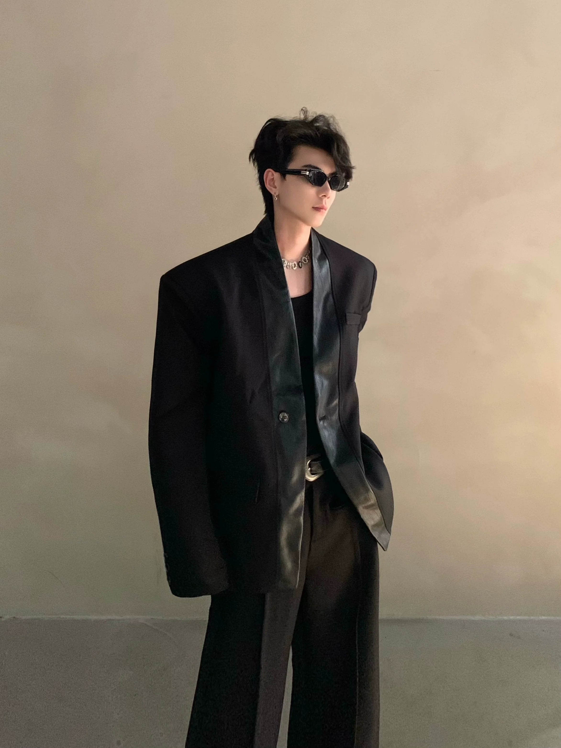 Autumn and winter black collarless suit splicing leather jacket profile shoulder pads light luxury ruffian handsome high-end jacket R004